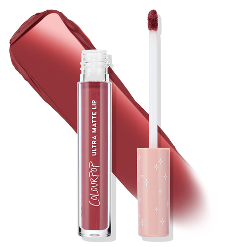 ColourPop Bumble Ultra Matte Lip liquid lipstick stands open with doe-foot applicator beside it, revealing a warm rosy mauve swatch; clear tube labeled Ultra Matte Lip, pink cap with star accents, studio white backdrop.