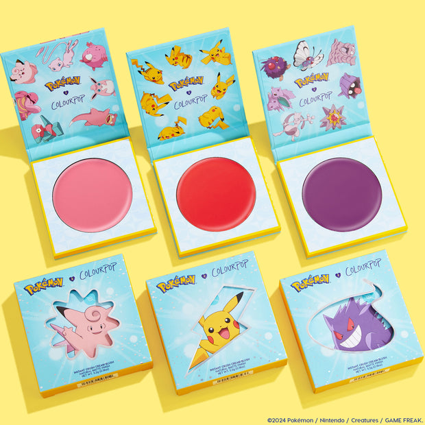 Electrifying Dreams ColourPop Cream Blush set presenting three open pans - soft pink, bright red, and deep purple - inside teal Pokémon-themed compacts, with matching boxes showing Clefairy, Pikachu, and Gengar on a bright yellow background.