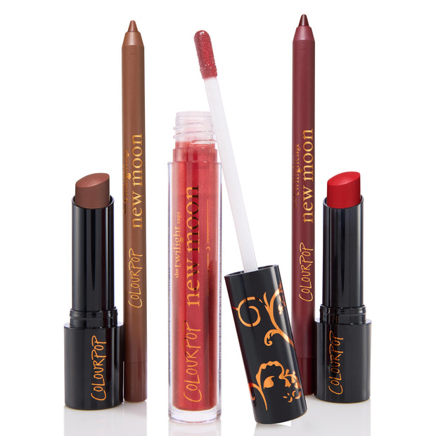 Pack Member ColourPop Lip Set displaying two New Moon lip liners (brown and berry), a shimmery red gloss with doe-foot wand, and two lipsticks - nude brown and vibrant red - in black tubes with gold script, arranged upright on a white background.