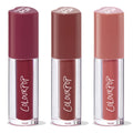 Trio of ColourPop Lip Stain, Everyday Besties, standing upright - clear tubes with ColourPop logo and heart-shaped caps in deep berry, warm mocha, and soft rosy nude shades, grouped as a bundle on a white background.