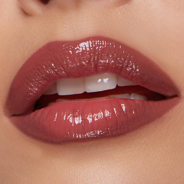 Glossy, plumped pink‑mauve lips softly parted, lined and filled with Glazed Pout from the ColourPop So Juicy Plumping Lip Liner & Balm Set, shown in a studio close‑up to highlight high‑shine finish, smooth texture, and precise definition.