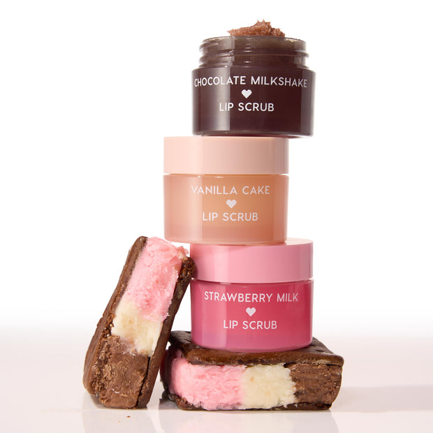 Neapolitan Sundae ColourPop Lip Scrub trio - Strawberry Milk, Vanilla Cake, and Chocolate Milkshake - stacked with the top jar open to show scrub texture, flanked by Neapolitan ice cream sandwiches on a white background.