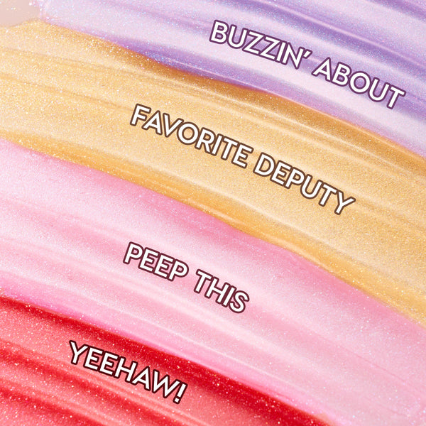 Four shimmering swatches display Squad Dreams ColourPop Ultra Glossy Lip - lavender Buzzin’ About, golden Favorite Deputy, baby‑pink Peep This, and cherry red Yeehaw! - swept in wide bands to showcase sparkle and high‑shine finish.