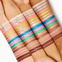 Hey Bestie ColourPop Shadow Stix swatch - a soft shimmery neutral - shown across four arms of varying skin tones with rows of labeled shades to compare color payoff and finish, highlighting the Shadow Stix collection.