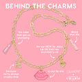 Gold chain charm necklace showcases pink enamel lips reading ColourPop, a bunny, a gold strawberry, and mini So Juicy lip oil tube charms, styled on a bubblegum-pink background for the Charmed and Juicy ColourPop So Juicy Lip Oil and Necklace Set.