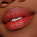Full lips wearing Bumble ColourPop Lippie Pencil, a warm terracotta red lip liner used to define and fill for a smooth, creamy finish, shown in an extreme close-up beauty shot.