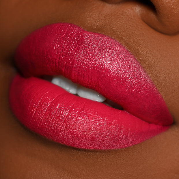 Close-up lips wearing I Heart This ColourPop Lippie Pencil, lining and filling the mouth in a vibrant fuchsia-red with smooth, creamy coverage and crisp edges, showcased in a studio beauty shot to highlight pigment and precision.