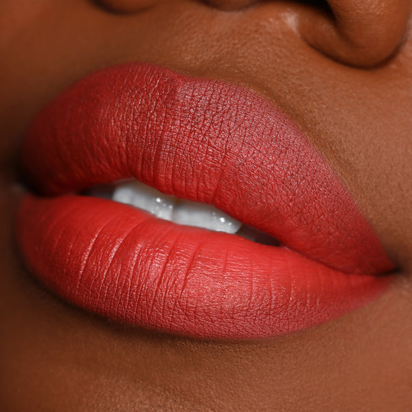 Matte, terracotta-red lips showcasing the Love Bug shade, lined and filled with the ColourPop Lippie Pencil, captured in a tight studio close-up to highlight smooth texture and precise edges for this Lippie Pencil product.