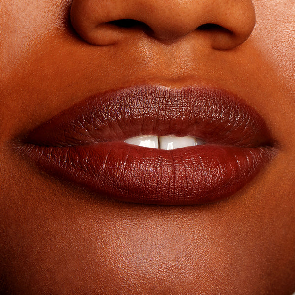 Lips wearing ColourPop Lippie Pencil in CTRL, lined and fully filled to showcase a deep cocoa-brown shade with a creamy satin finish, crisp edges, and smooth coverage in a close-up beauty swatch on model skin.