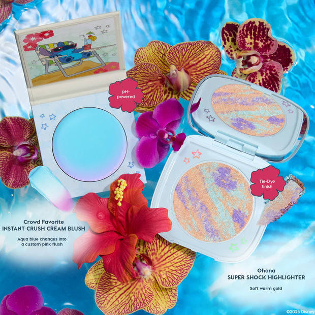 Crowd Favorite Instant Crush Cream Blush compact opens to reveal an aqua-blue, pH-powered formula that shifts to a custom pink flush, styled poolside with orchids and a Stitch beach motif, beside the ColourPop Super Shock Highlighter.