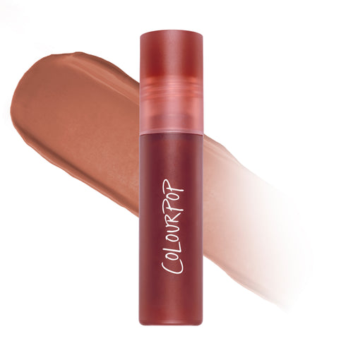 ColourPop Candy Floss Cloud Whip Blurring Liquid Lipstick standing upright against a soft nude-pink swatch, showing the frosted rose cap and matte tube that highlights the airy Cloud Whip formula and blurring finish for lips.