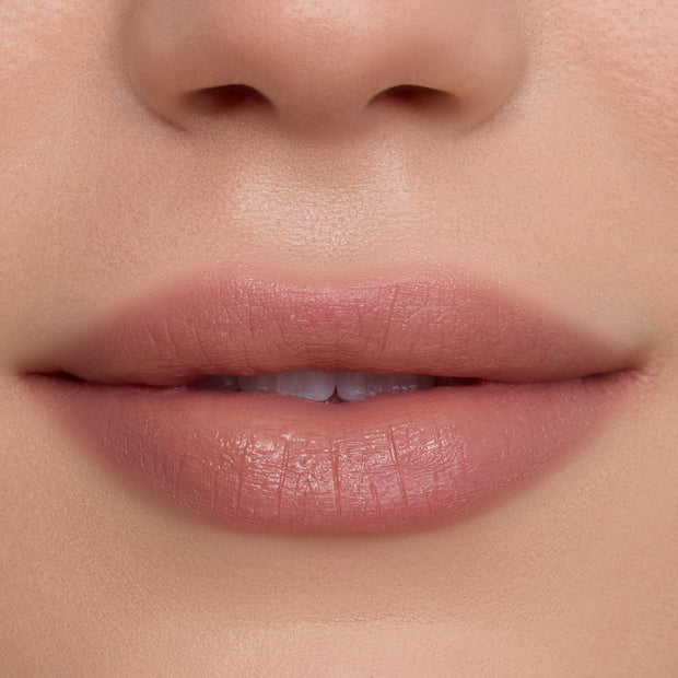 Close-up of a model’s lips wearing Candy Floss Cloud Whip Blurring Liquid Lipstick, showing a soft pink nude shade with a smooth, blurred, satin finish against natural, even-toned skin, highlighting the airy Cloud Whip formula.