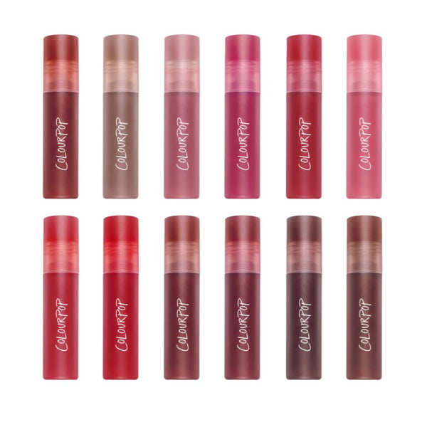 Cloud Kissed Full Collection Set of 12 ColourPop Cloud Whip blurring liquid lipsticks arranged in two rows, featuring a gradient of nude, pink, red, and berry shades in frosted tubes with bold white logo on a white background.