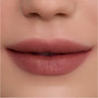 Close-up of smooth, full lips wearing Cloudy Hour Cloud Whip Blurring Liquid Lipstick in a soft mauve nude shade, showing a velvety, blurred-matte finish against natural, even-toned skin for a comfortable everyday lip look.