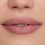 Close-up of a model’s lips wearing In a Haze Cloud Whip Blurring Liquid Lipstick, showing a soft matte nude-pink finish with smooth, blurred edges against natural, even-toned skin, highlighting the lightweight Cloud Whip texture.