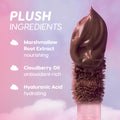 Cloud Crushin lip trio doe-foot applicator swirled with whipped mauve liquid lipstick against a pink and purple cloud background, highlighting plush ingredients—marshmallow root extract, cloudberry oil, and hyaluronic acid—promoted as nourishing Value Sets.