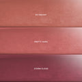 Cloud Crushin lip trio swatches showing three CloudWhip Blurring Liquid Lipstick shades—warm nude So Dreamy, rosy mauve Pretty Aura, and deep berry Storm Cloud—stacked in horizontal bars on a soft gradient background, ideal for makeup value sets shoppers.