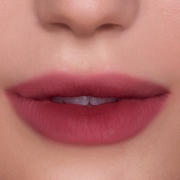 Close-up of softly blurred ombre lips wearing Petal Cloud Lip Ombre Duo, showing a gradient pink-mauve matte finish on smooth skin, highlighting the CloudWhip-inspired lip look for beauty Value Sets shoppers.