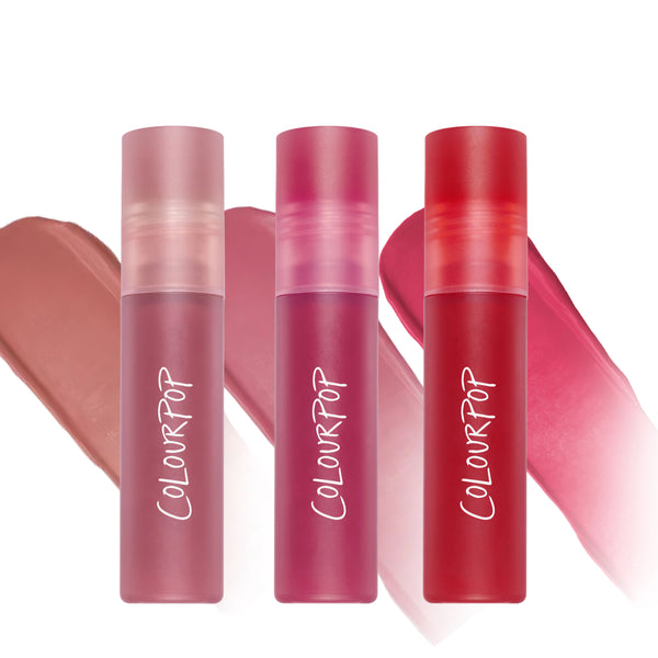 ColourPop Petal Plush Lip Trio value set with three frosted tubes of Cloud Whip Blurring Liquid Lipstick in nude, rose, and bright red shades, shown upright against matching lip color swatches on a white background.