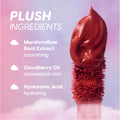 Sky’s the Limit Cloud Whip Blurring Liquid Lipstick wand tipped with whipped rosy pigment, shown against a dreamy pink and purple sky with text highlighting plush ingredients: marshmallow root extract, cloudberry oil, and hyaluronic acid.