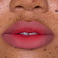 Close-up of full lips wearing Sunset Smooch Lip Ombre Duo, showing a smooth pink-to-coral gradient with a soft-matte blurred finish, ideal for beauty lovers shopping lip value sets in the US.