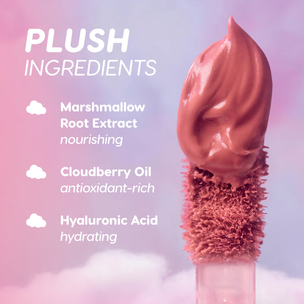 Cloud Whip On Cloud 9 Blurring Liquid Lipstick applicator swirls rich mauve formula against a pink and purple sky backdrop, highlighting plush ingredients marshmallow root extract, cloudberry oil, and hyaluronic acid for nourishing, hydrating color.