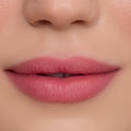 Close-up of smooth, softly blurred pink lips wearing On Cloud 9 Cloud Whip Blurring Liquid Lipstick, showing velvety matte finish and even color payoff against flawless skin for a natural everyday makeup look.
