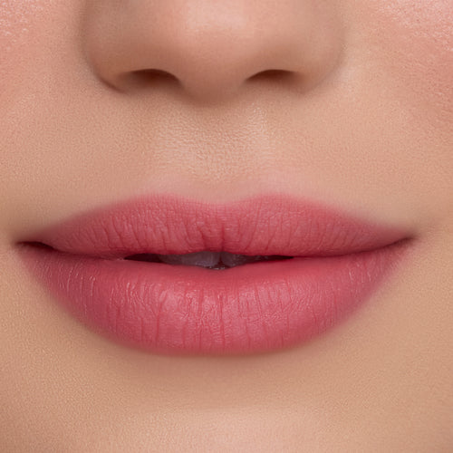 Close-up of smooth, softly blurred pink lips wearing On Cloud 9 Cloud Whip Blurring Liquid Lipstick, showing velvety matte finish and even color payoff against flawless skin for a natural everyday makeup look.