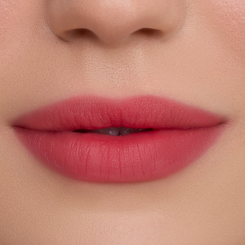 Close-up of smooth, soft-focus lips wearing Sky’s the Limit Cloud Whip Blurring Liquid Lipstick, showing an airy, diffused pink finish with blurred edges against natural, even-toned skin, highlighting the lightweight Cloud Whip texture.