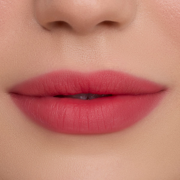 Close-up of smooth, soft-focus lips wearing Sky’s the Limit Cloud Whip Blurring Liquid Lipstick, showing an airy, diffused pink finish with blurred edges against natural, even-toned skin, highlighting the lightweight Cloud Whip texture.