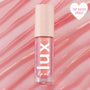 ColourPop Lux Lip Oil in Comb By shade standing upright, displaying a shimmery pink gloss in a clear tube with a blush cap and star accents, set against a rippled pink backdrop with a heart badge reading Top Rated Shade.