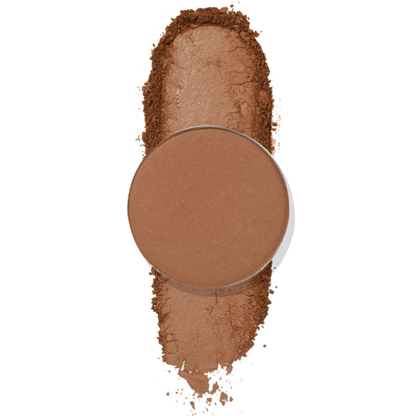 Conundrum pressed powder shadow by ColourPop showing a round pan of matte warm brown eyeshadow resting over a vertical swipe of crushed pigment on a white background.