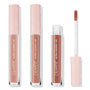 Three ColourPop Ultra Glossy Lip tubes in Cool Nudes stand upright, one opened with a doe-foot applicator, showing cool-toned nude gloss; clear barrels and blush pink star-printed caps on a white background, three-piece nude lip gloss bundle.