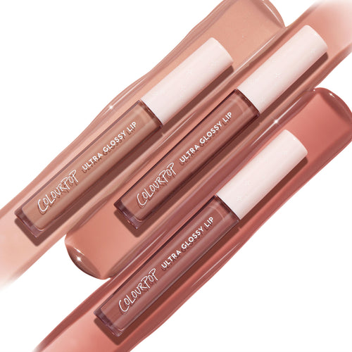 Three ColourPop Ultra Glossy Lip tubes in Cool Nudes arranged diagonally over matching swatches, showcasing cool‑toned beige, taupe, and rosy nude glosses with white star caps and a high‑shine finish - an everyday lip gloss set.