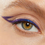 Chrome Hearted Chrome Crème Gel Liner creates a sharp double wing on the upper lash line, shifting from purple to electric blue with a metallic sheen on a close-up eye, highlighting the smooth, long-wear finish of the ColourPop Chrome Crème Gel Liner.
