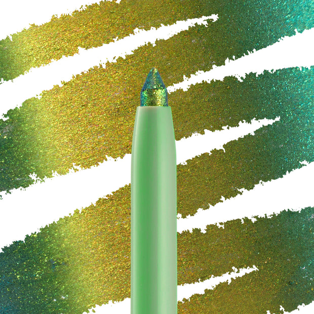 Wild Idea ColourPop Chrome Crème Gel Liner displays a multichrome tip shifting teal, green, and gold, drawing creamy strokes across a swatched backdrop; mint twist-up pencil in macro close-up for bold, long-wear eye looks.
