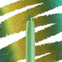 Wild Idea ColourPop Chrome Crème Gel Liner displays a multichrome tip shifting teal, green, and gold, drawing creamy strokes across a swatched backdrop; mint twist-up pencil in macro close-up for bold, long-wear eye looks.