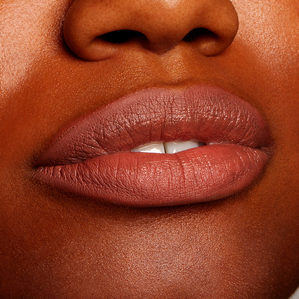 Matte-lined lips wear BFF2, a warm midtone nude brown, precisely outlining and softly filling the lips; ColourPop Lippie Pencil delivers smooth, even coverage in a tight beauty close-up.