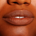 Lips wearing BFF3 ColourPop Lippie Pencil, lining and filling the mouth in a warm brown nude shade with a smooth, non-glossy finish; tight close-up swatch on lips highlighting precise color payoff and definition.