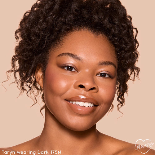 Model close-up showing smooth, natural coverage from the ColourPop Pretty Fresh Creamy Concealer in Dark 175 N, with a dewy under-eye finish against a neutral backdrop, demonstrating even tone and hydrated glow.