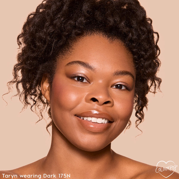 Model close-up showing smooth, natural coverage from the ColourPop Pretty Fresh Creamy Concealer in Dark 175 N, with a dewy under-eye finish against a neutral backdrop, demonstrating even tone and hydrated glow.