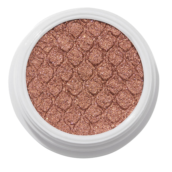 ColourPop Deep Dive Super Shock Shadow sparkles in an open white pot, a metallic bronze‑rose gold cream‑to‑powder eyeshadow with fine glitter and fish‑scale embossing, shown close‑up on a white background.