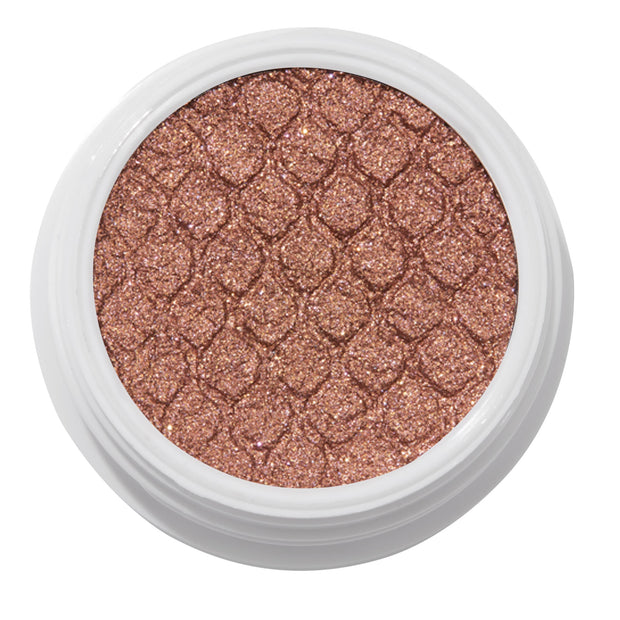 ColourPop Deep Dive Super Shock Shadow sparkles in an open white pot, a metallic bronze‑rose gold cream‑to‑powder eyeshadow with fine glitter and fish‑scale embossing, shown close‑up on a white background.