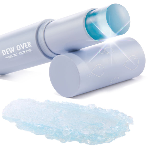 Dew Over Serum Stick glides open to reveal a cooling translucent blue balm, with an icy-blue swatch beside the light lavender tube, showcasing the hydrating ColourPop Serum Stick for dewy skin on a white background.