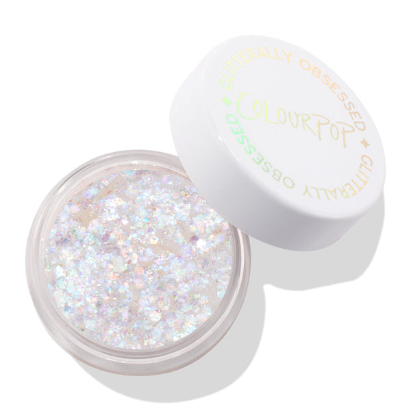 Disco Lady ColourPop Glitter Gel jar sits open, revealing opalescent, chunky glitter suspended in a clear base, while the white cap printed “Glitterally Obsessed” rests ajar on a clean white studio background.