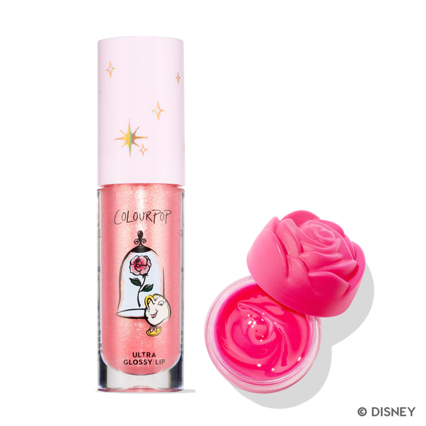 ColourPop Beautiful Belle Disney Princess set featuring a shimmery peach Ultra Glossy Lip tube with enchanted rose and Chip graphics beside an open hot pink rose-shaped Belle lip mask pot on a white background.
