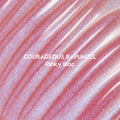 Courageous Rapunzel Ultra Glossy Lip swatch showing shimmery pinky lilac Disney Princess lip gloss with high-shine, iridescent glitter streaks spread in smooth, reflective waves on a close-up background.
