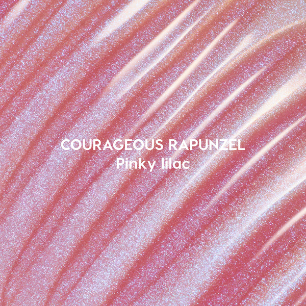 Courageous Rapunzel Ultra Glossy Lip swatch showing shimmery pinky lilac Disney Princess lip gloss with high-shine, iridescent glitter streaks spread in smooth, reflective waves on a close-up background.