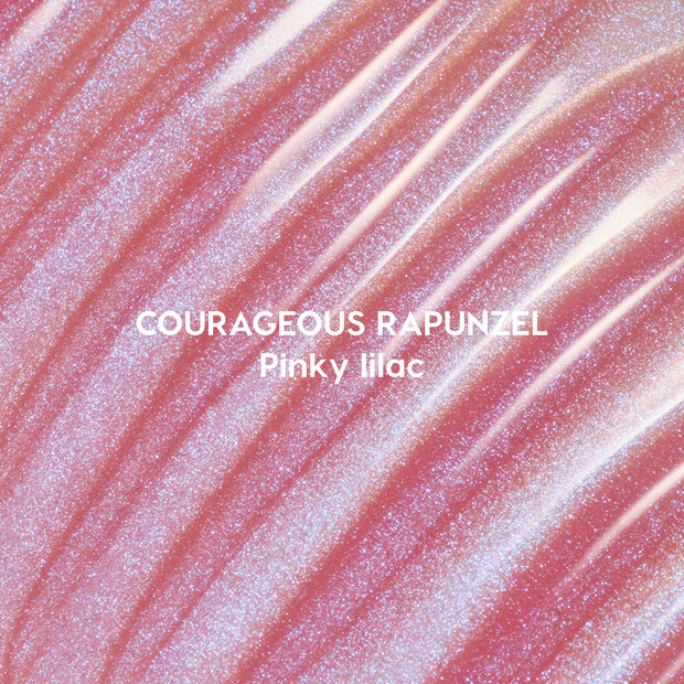 Courageous Rapunzel Ultra Glossy Lip swatch showing shimmery pinky lilac Disney Princess lip gloss with high-shine, iridescent glitter streaks spread in smooth, reflective waves on a close-up background.