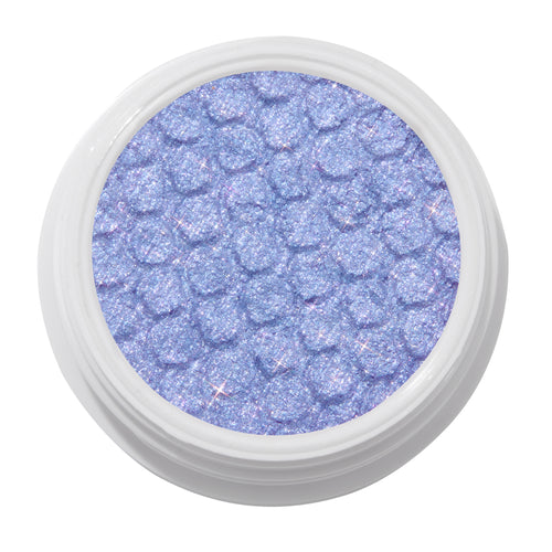 Dream Much shimmering lavender ColourPop Super Shock Shadow, a glittery lilac eyeshadow with bouncy dimpled texture, shown in a white round pot on a clean white background.